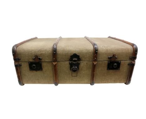 A 20th century trunk with interior removable compartment.