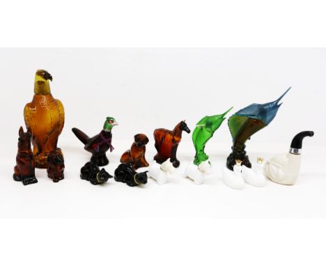 A large collection of vintage 1960s/70s Avon perfume/aftershave glass bottles in the form of animals, fish , cars, figures, l