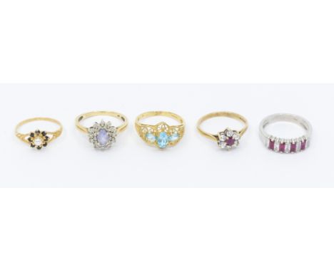A collection of five stone set 9ct gold rings, including a white gold synthetic ruby and quartz half eternity ring, width app
