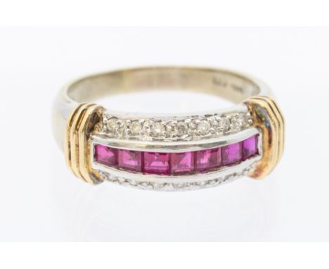 A ruby and diamond ring 14ct gold two tone ring, comprising a central row of channel set calibre cut rubies, each approx 2mm,