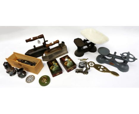 A mixed collection of metal wares to include flatwares, vintage irons, tools, tins, scales with weights, brass items etc.