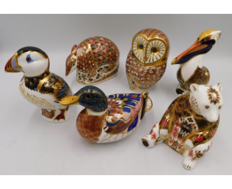 A collection of six Royal Crown Derby paperweights comprising of an Owl , a Brown Pelican, Aardvark, Puffin , Duck and a Imar