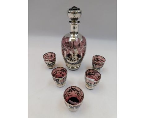 A 20th century purple glass decanter and five matching glasses, all decorated in silver painted designs. (6)