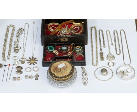 A collection of silver and white metal items including silver ingot pendant, heavy rope chain, various pendants and chains, a