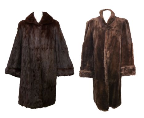 A 1950s brown squirrel fur coat with turned back cuffs, decorative lining, hook fastening and cowl collar along with a late 1