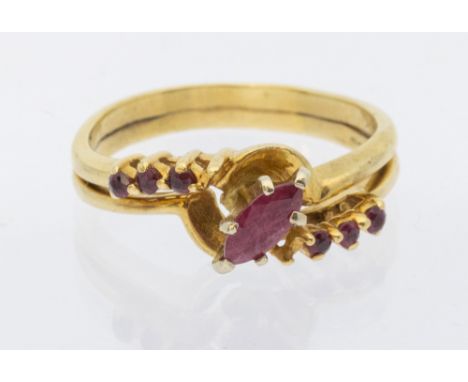 A ruby and 14k gold ring, comprising a central marquise cut ruby, approx 6x3mm, high setting, with small round mixed cut diam