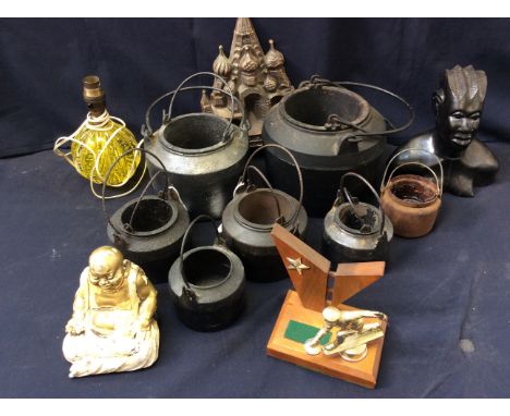 A collection of cast iron glue pots, a glass table lamp base, African figure with owl figure and more.
