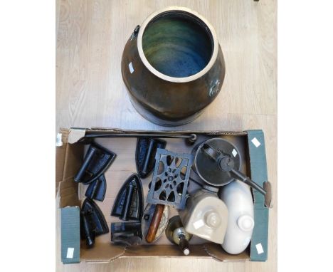 A collection of iron wares to include vintage 19th and early 20th Century irons, trivits, two handled scraper, foot warmers, 