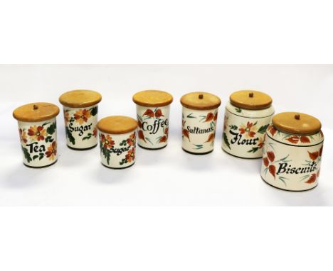 A collection of vintage John Raymond ceramic kitchen wares and pots with wooden lids along with vintage part coffee set. good