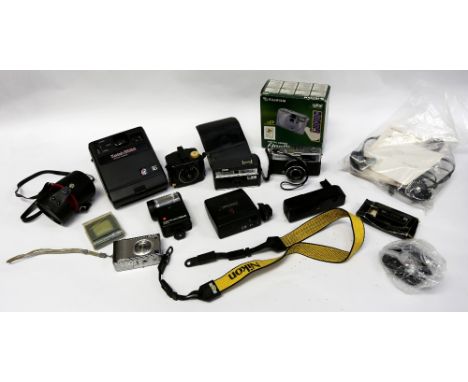A collection of vintage cameras and accessories to include vintage Kodak instant.