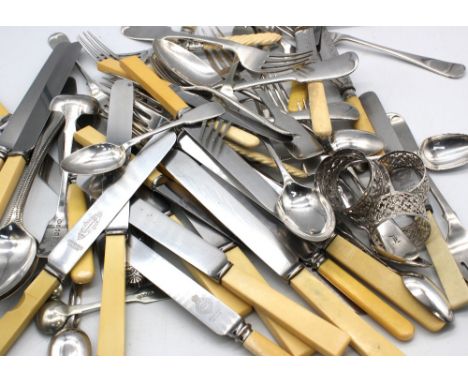 A quantity of mixed silver plated flat-wares, including resin handled knives; varying sized spoons and forks, fish forks and 