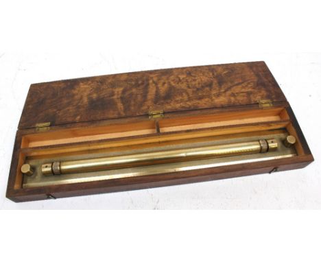 A 20th century military issue brass map plotters tool, cased, bearing military issue arrow mark