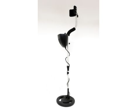A vintage 1980s metal detector, battery operated and working.