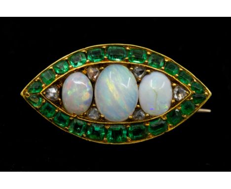 A Victorian opal, emerald and diamond set yellow metal brooch, comprising a marquise form set to the centre with three gradua