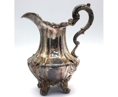 A William IV silver cream jug, of ornate shape with cast flowers and foliate sides, scrolled handle and upon four splayed fee