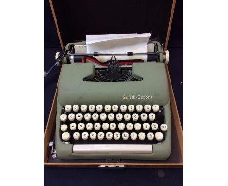 A 1950s Smith-Corona cased typewriter, in great condition.
