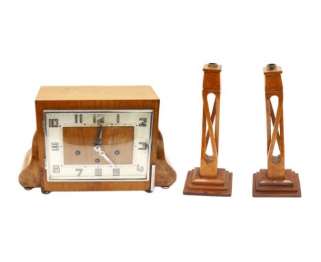 A 1930s mahogany art deco 8 day with westminster chime mantle clock with Arabic numerals along with a pair of mahogany candle