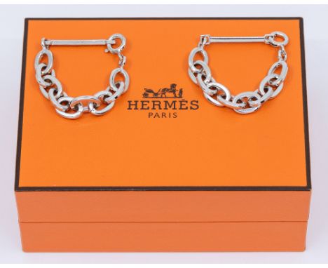 A pair of silver chain link cufflinks comprising a bar and chain link with bolt clasp fitting, open length approx 80mm, along