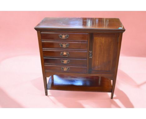 A collection of furniture to include; a mahogany music cabinet with five drawers and cupboard; a pokerwork wall hanging with 
