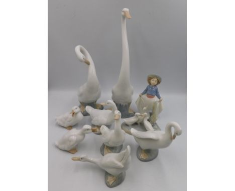 A collection of 9 Nao figures of swans with geese and girl figure. tallest figure approximate height 34cm , all in&nbsp;good 
