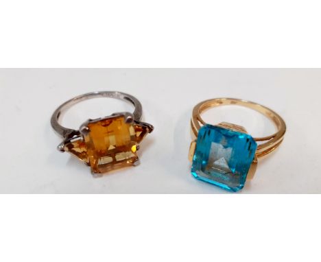 An 18ct gold and pale blue cabochon ring together with a silver and amber coloured cabochon ringLocation: Cab 