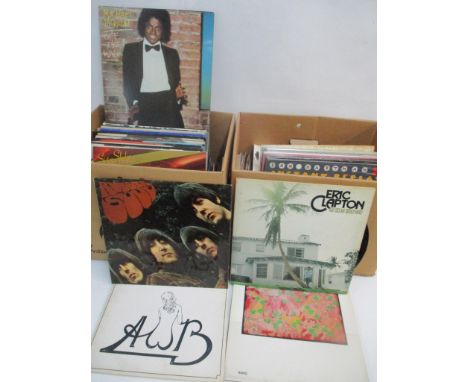 Two boxes of albums and records to include Pink Floyd, Eric Clapton, Michael Jackson, The Beatles and others 