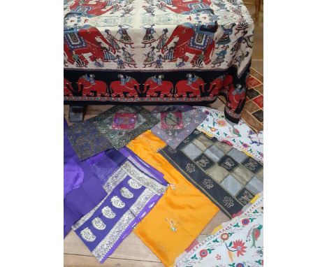A quantity of 20th Century Eastern textiles to include an Indian cotton tablecloth depicting printed figures on elephants, cu