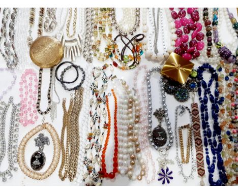 Mixed 1960's to 1980's costume jewellery, mainly bead necklaces together with 2 vintage gold tone compacts, one an RAF compac