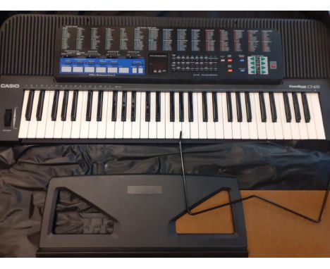 A Casio Tone Bank CT-670 keyboard in a padded travel bag with folding Casio standLocation: RWF 