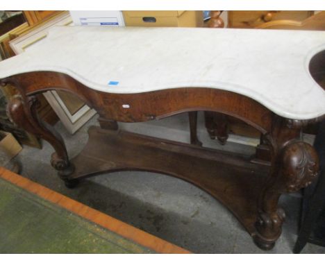 A Victorian oak and marble topped console table having cabriole and scroll shaped supports and a shelf below, 91cm h x 153cm 