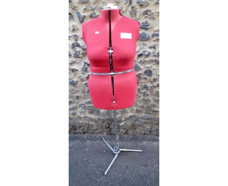 A vintage dressmakers plus-size adjustable mannequin, an electric Singer sewing machine (requires rewiring), large cotton ree