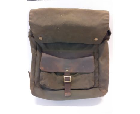 A vintage Barbour wax cotton urban backpack in olive with brown leather pocket flap, originally retailed at John Lewis for £1
