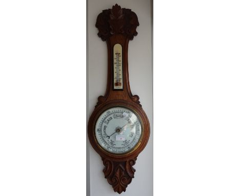A VICTORIAN OAK BANJO BAROMETER