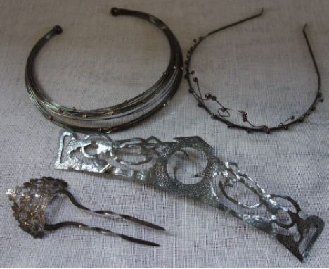 A COLLECTION OF HAIR ORNAMENTS, to include a white metal tiara and a silver two prong hair comb