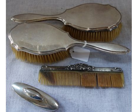 A PAIR OF SILVER BACKED HAIR BRUSHES, comb and nail buffer (4)