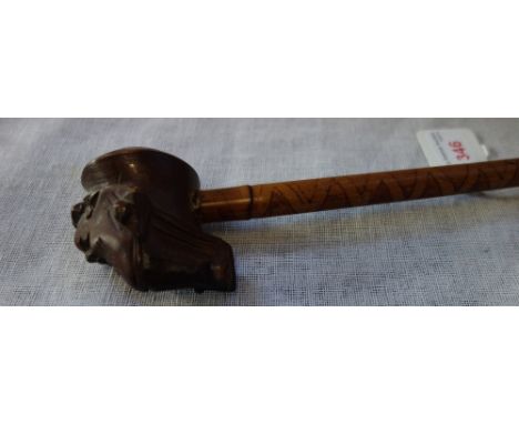 A TRIBAL PIPE with a bamboo shaft and carved wooden bowl,&nbsp; 97cm high