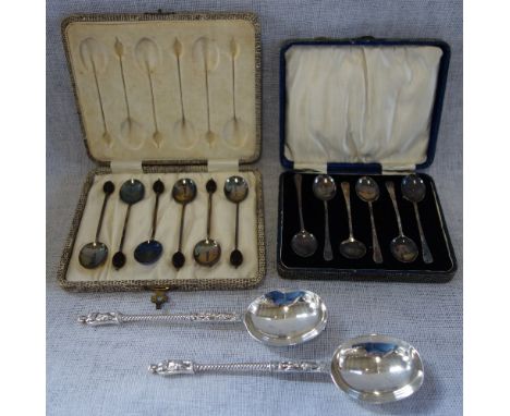 A SET OF SIX SILVER AND ENAMEL COFFEE SPOONS in a fitted presentation case, one other silver set in a fitted presentation cas