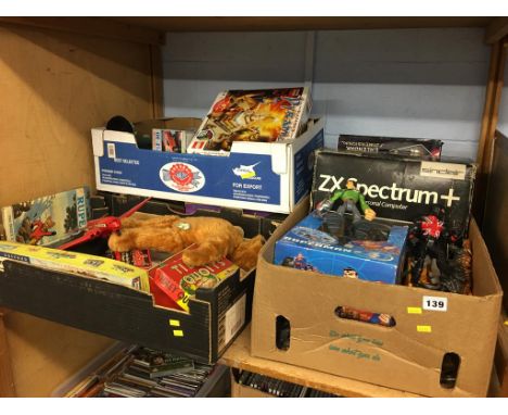 Four boxes of assorted vintage toys
