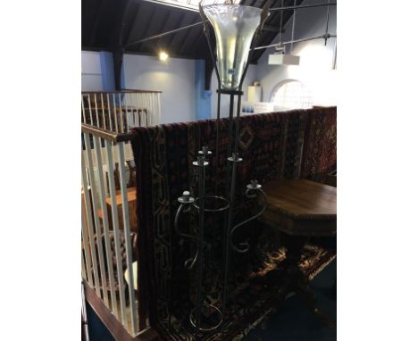 Wrought iron stand and a metalwork candle stick