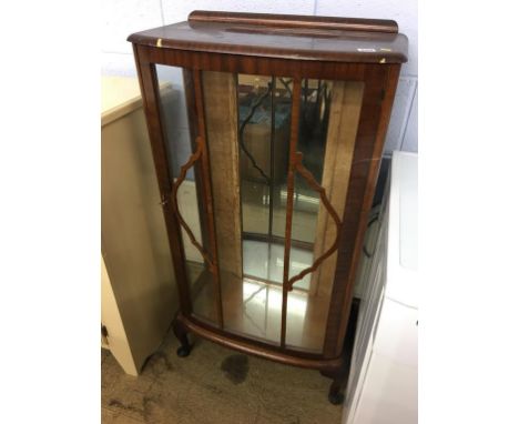 Walnut china cabinet and a standard lamp.