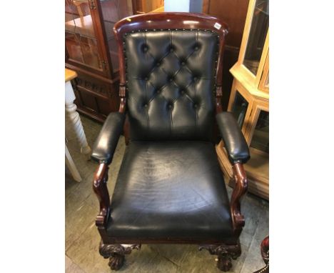 Mahogany button back armchair, upholstered in black leather