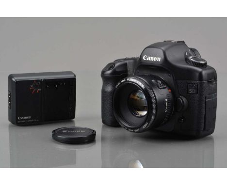 A Canon EOS 5D DSLR Camera, powers up, shutter working, display working, body G-VG, with EF 50mm f/1.8 II lens, auto focus wo