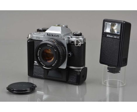 A Nikon FG SLR Camera, chrome, shutter working, meter responsive, camera responsive in auto, self timer working, body G-VG, s