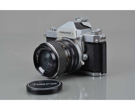 A Nikon Nikkormat FTn SLR Camera,  chrome, shutter working, self timer working, meter unresponsive, body G, with Tokina 35mm 