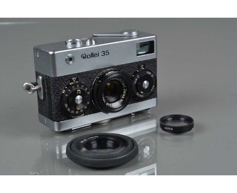 A Rollei 35 Compact Camera, made in Germany, shutter working, meter responsive, body G, tiny ding to top plate, with Carl Zei