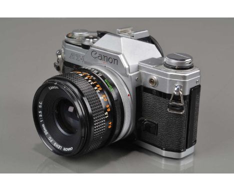 A Canon AT-1 SLR Camera, shutter working, meter responsive, self timer working, body G, with Canon FD 35mm f/3.5 S.C. lens, b