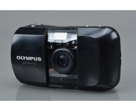 An Olympus mju 1 Compact Camera, shutter working, flash working, self timer working, body G, some surface scratches, elements