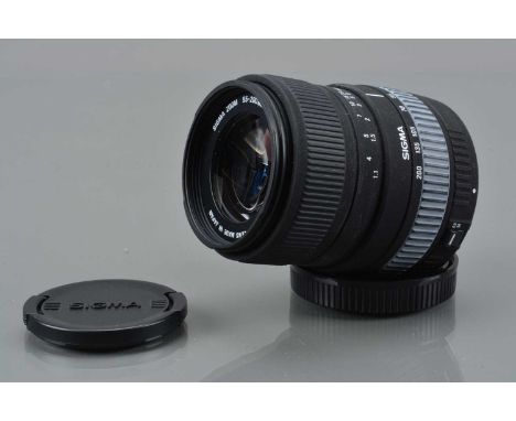 A Sigma 55-200mm f/4-5.6 DC Lens, Canon EF mount, auto focus working. barrel G-VG, fading to zoom grip, elements VG, with fro