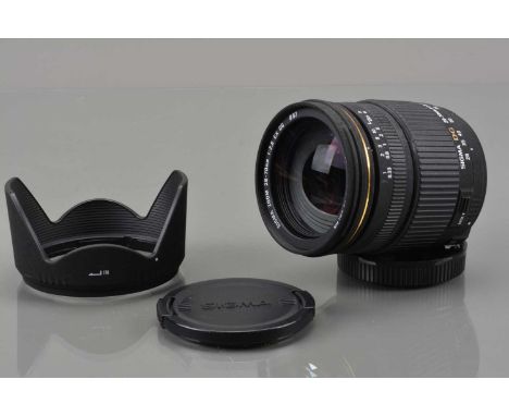 A Sigma DG 28-70mm f/2.8 EX Lens,  Canon EF mount, auto focus working, barrel G, some fading to grip, elements VG, with front