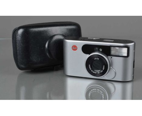 A Leica C1 Compact Camera, powers up, shutter working, flash working, self timer working, body G, lens door not fully closing